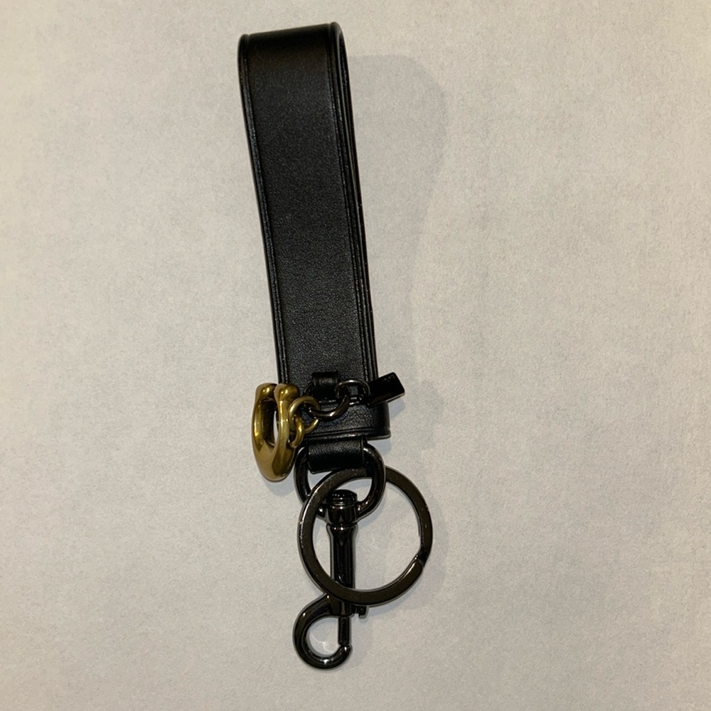 Coach leather keychain. Black leather with gunmetal hardware. Brass C.